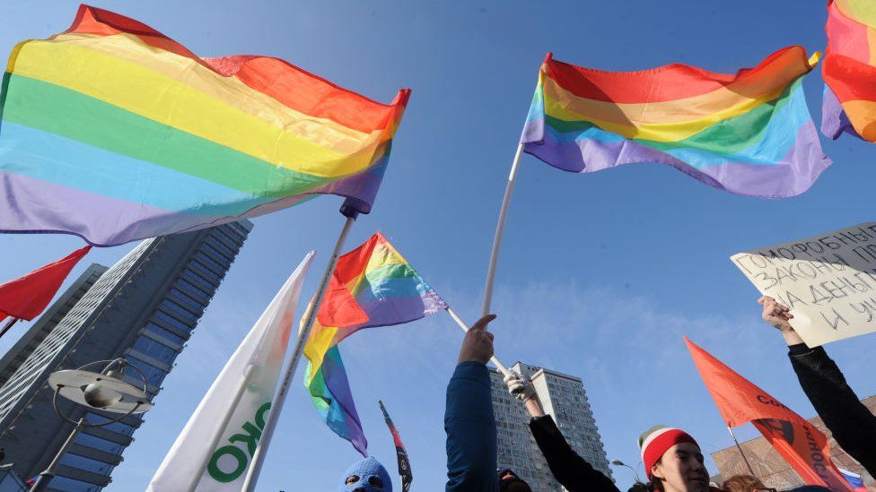 LGBT flags at a previous protest in St Petersburg