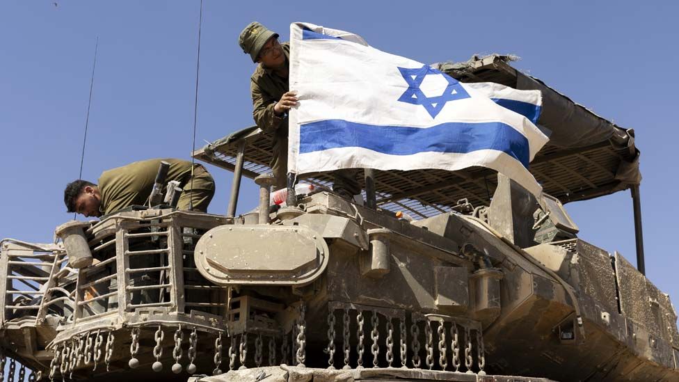 Israeli tank and flag