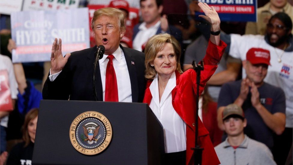 U.S. President Donald Trump and Republican U.S. Senator Cindy Hyde-Smith speak to supporters during a Make America Great Again rally in Biloxi, Mississippi, U.S., November 26, 2018. REUTERS/Kevin Lamarque