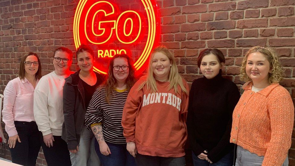 Molly (second left) and the podcast team