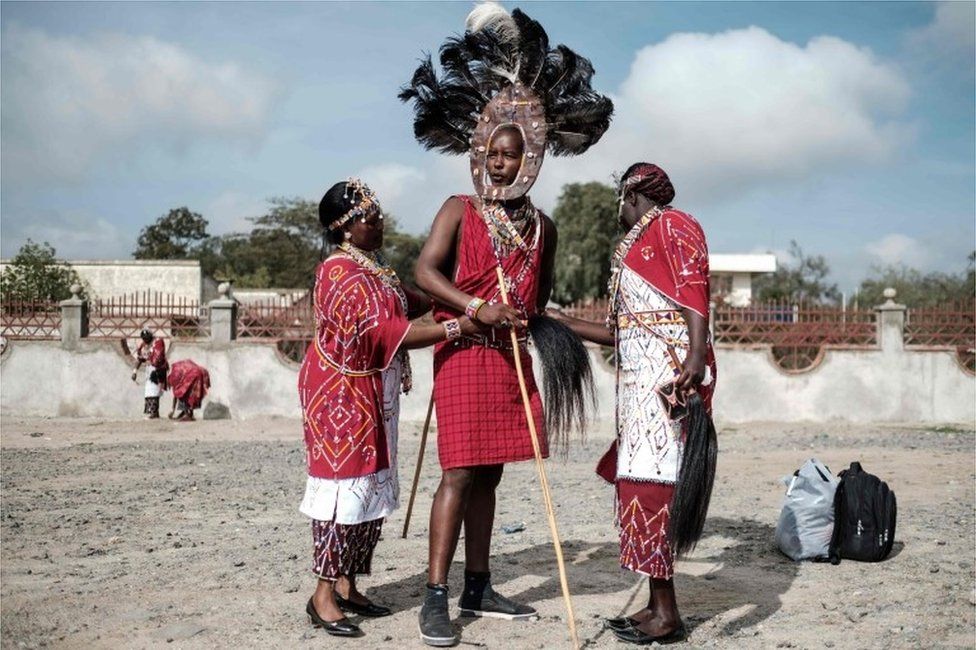 Staff of Kajiado county government prepare their Maasai tribe costumes for their cultural performance before Kajiado half Marathon calling for peace and cohesion in Kajiado, Kenya, on November 18, 2017.