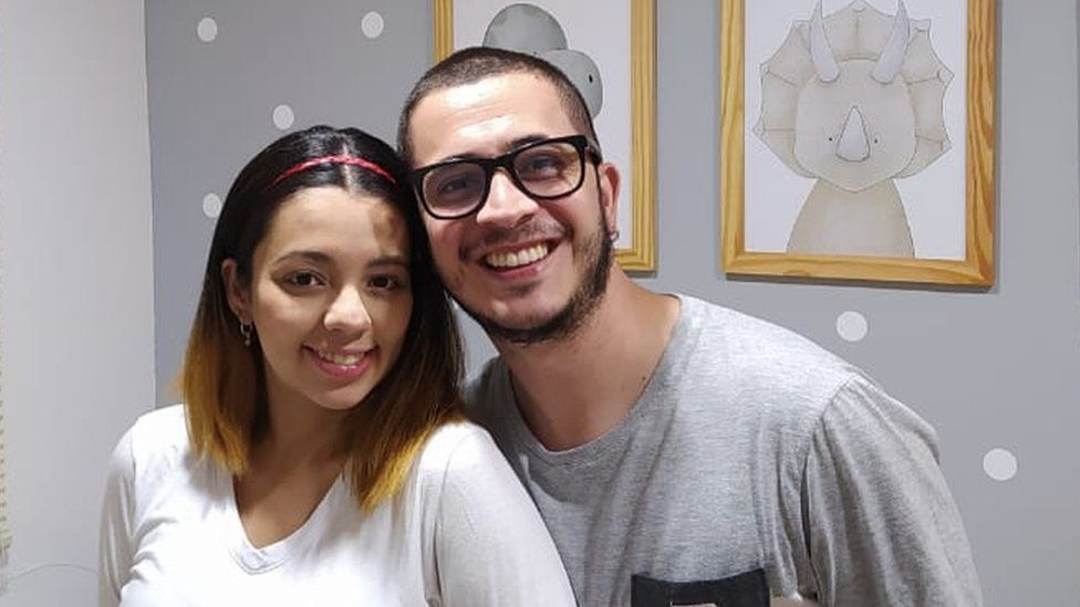 Daniel Guzmán and his wife pose for a photo