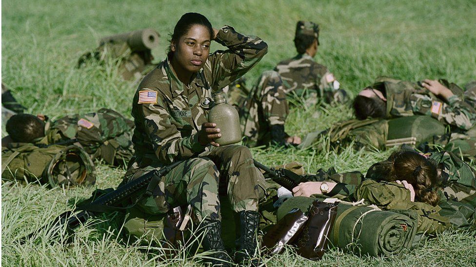 Female soldier in field 1994