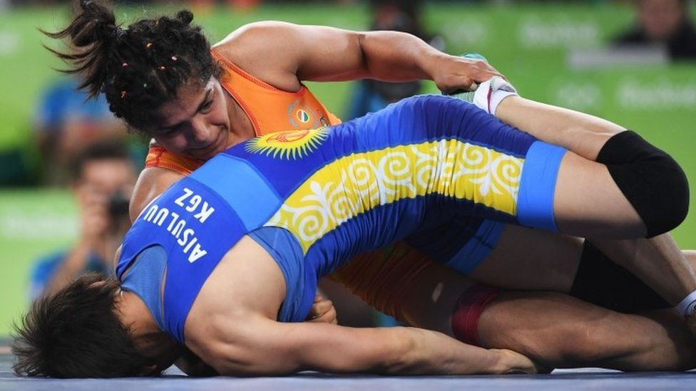 India"s Sakshi Malik (red) wrestles with Kirghyzstan"s Aisuluu Tynybekova in their women"s 58kg freestyle bronze medal match on August 17, 2016, during the wrestling event of the Rio 2016 Olympic Games at the Carioca Arena 2 in Rio de Janeiro. / AFP PHOTO / Toshifumi KITAMURATOSHIFUMI KITAMURA/AFP/Getty Images