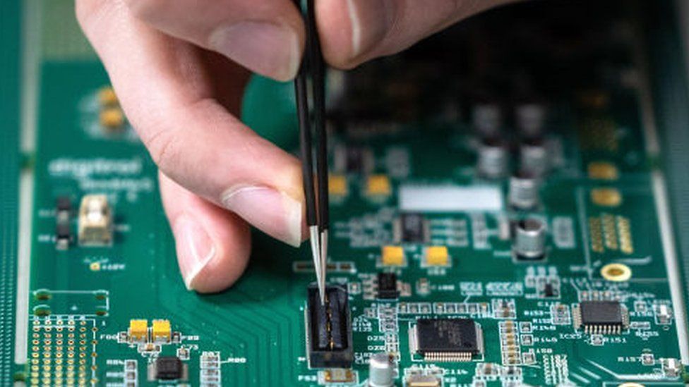 A close-up of microchips on a circuit board.