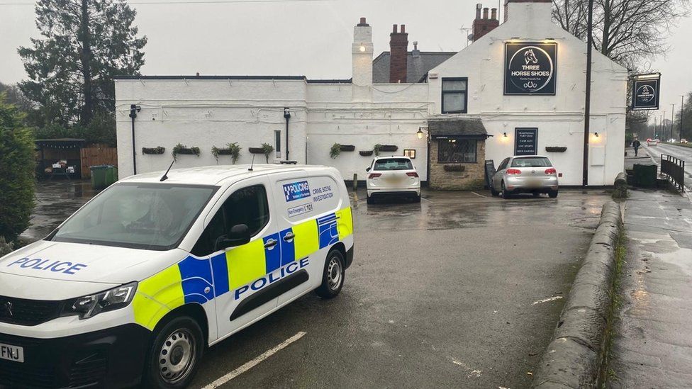 Police van outside pub