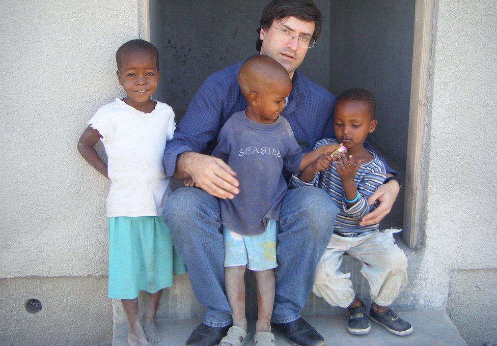 Dr Bartolo with some African children