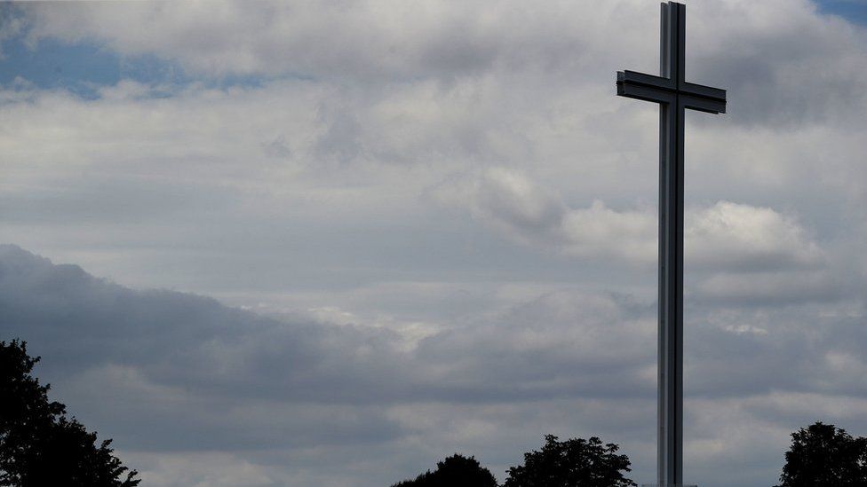 A person walks towards the Papal Cross in Dublin