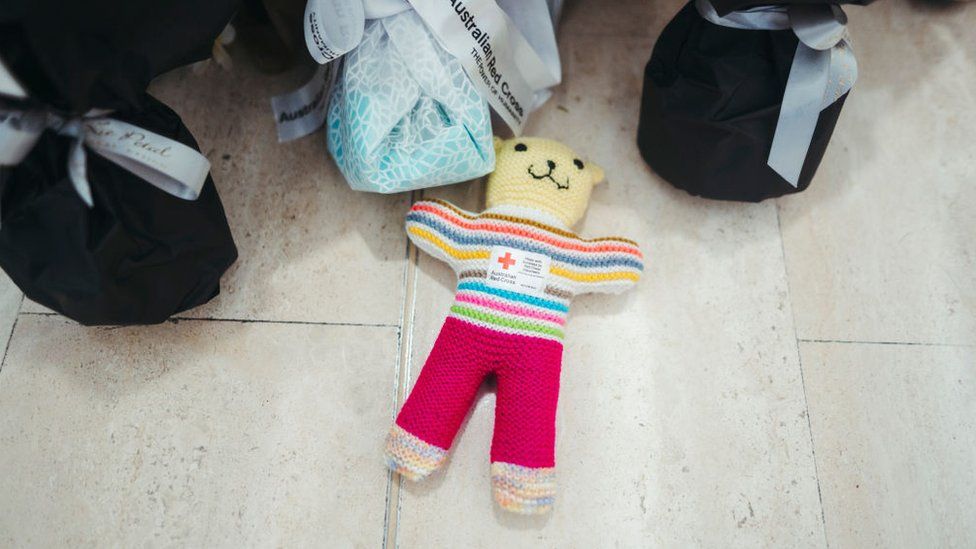 A teddy is laid at the Westfield Bondi Junction shopping centre during a day of reflection