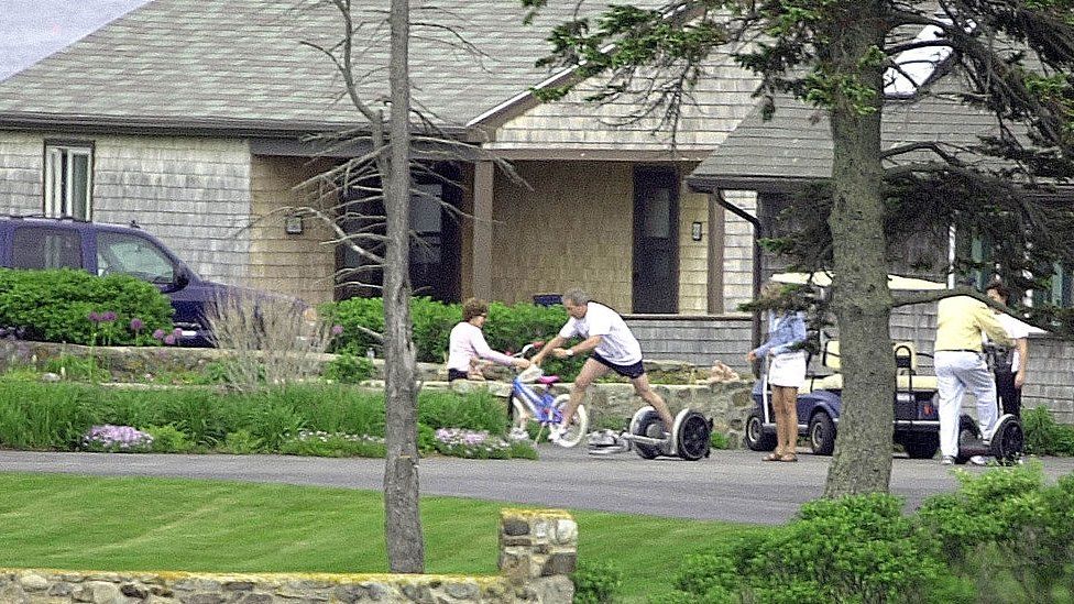 George W. Bush falls off a Segway Scooter at his parent's home.