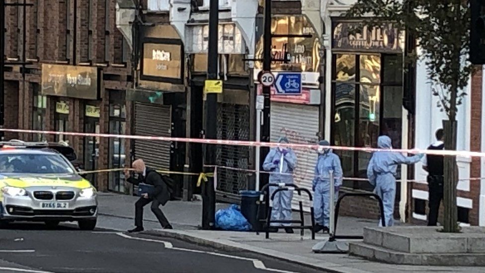 A police crime scene in Sydenham Road, south-east London, after a man in his twenties was found with gunshot wounds and died at the scene on Sunday afternoon