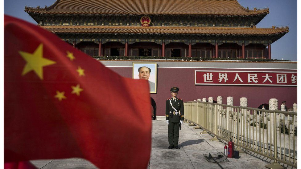A solider stands in front of Tiananmen Gate in Beijing
