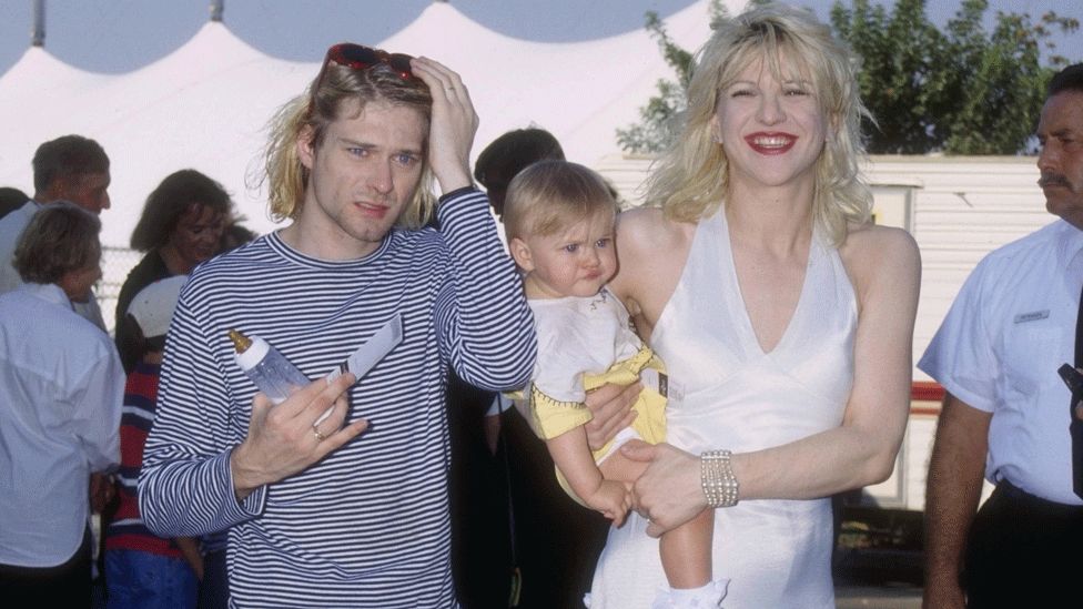 Kurt Cobain, Courtney Love holding Frances Bean