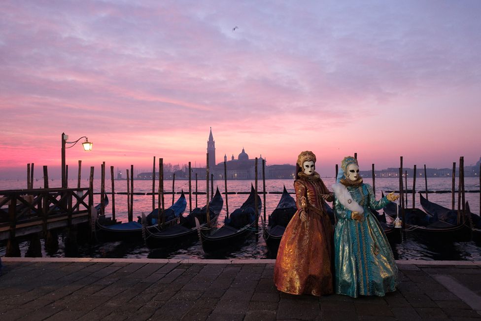 Masked revellers take part in the Venice carnival in St. Mark's Square in Venice, Italy, February 3, 2024.