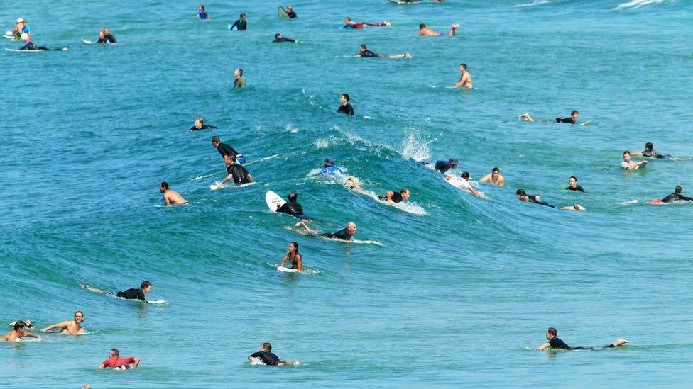 Surfers are seen at Maroubra beach despite the beach being closed on March 22, 2020 in Sydney, Australia.