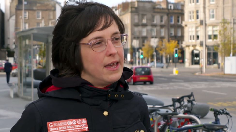 Ellie Harrison, chair of the Get Glasgow Moving campaign, being interviewed beside a road