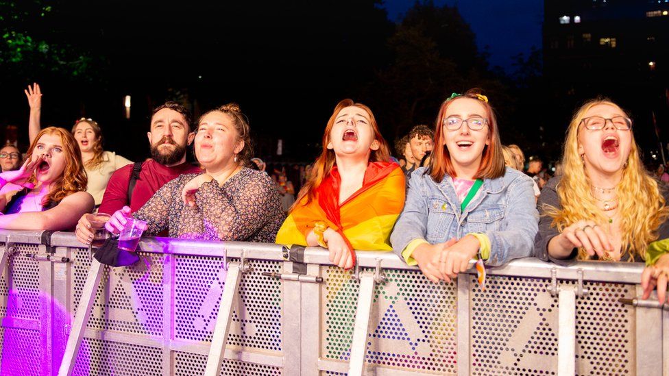 People watch Manchester Pride perfromance