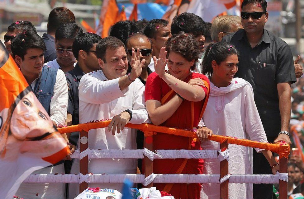 Rahul Gandhi and sister Priyanka Gandhi Vadra wave at supporters before Rahul filed his nomination papers for the general election, in Amethi in Uttar Pradesh state on April 10, 2019