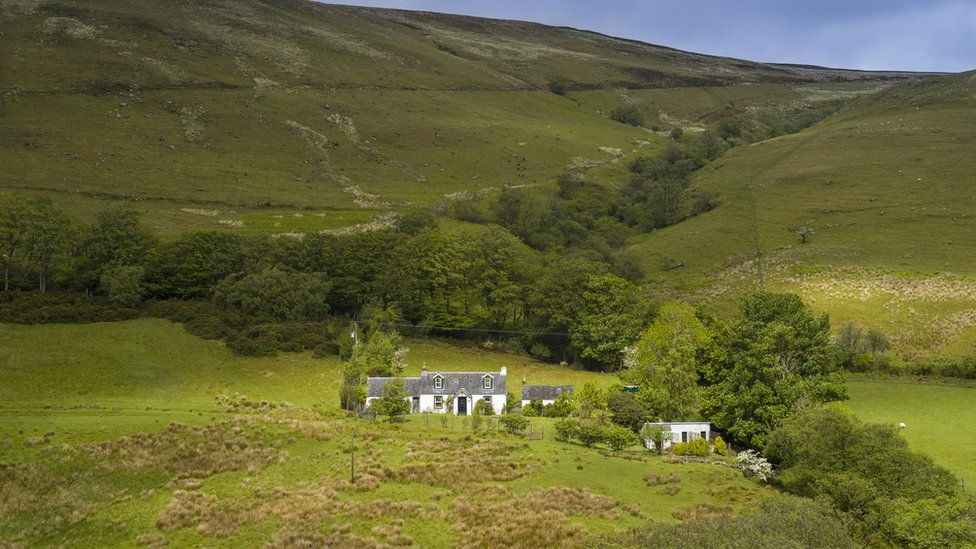 Quaint farm smallholding in rural mountain scene near Lochranza on Isle of Arran, Scotland.
