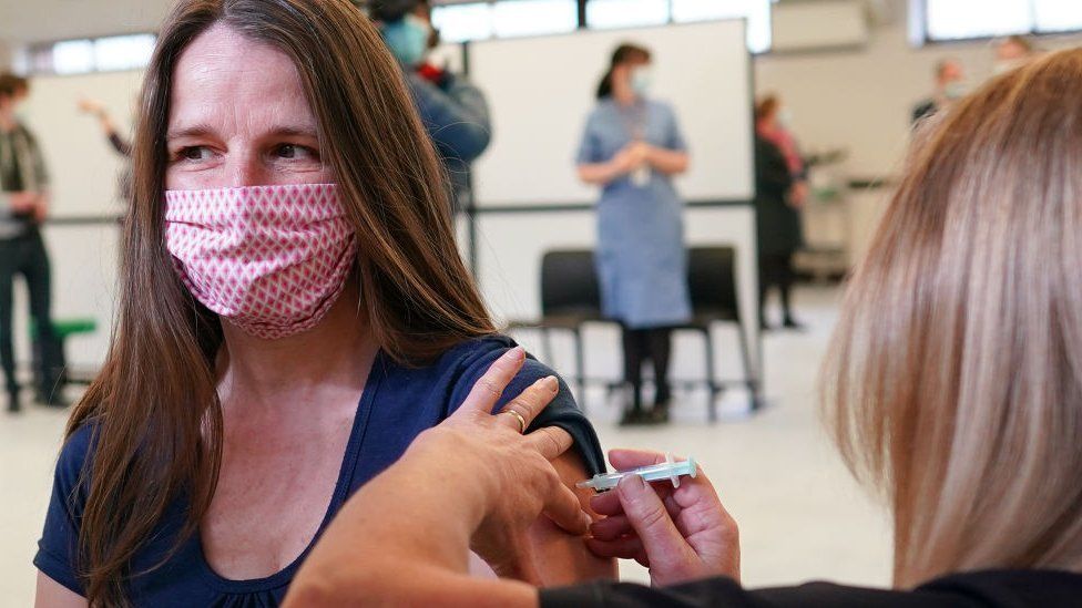 Woman being vaccinated in Penrith, England, in March