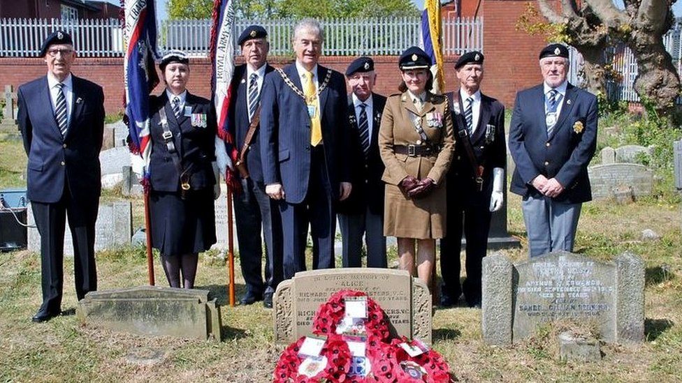 At the grave of Private Richard George Masters VC in Southport - the Mayor and Major Danielle Aspin plus Standard Bearers and Veterans