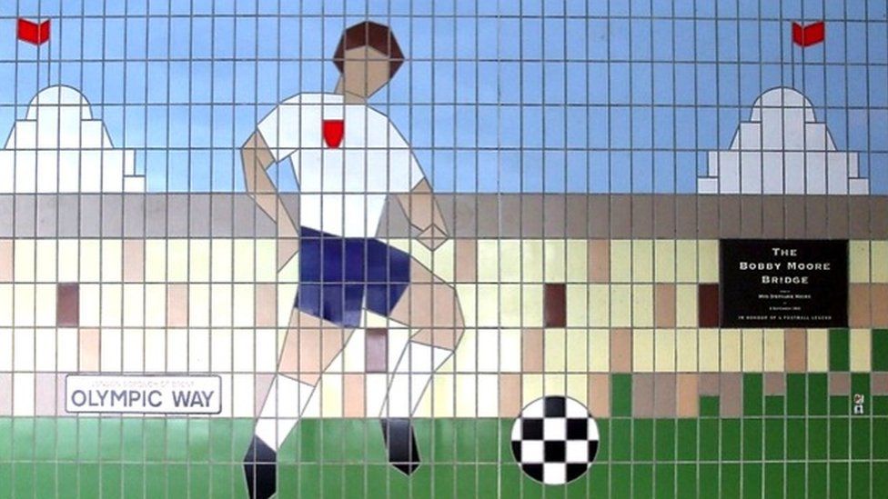 Tile mural showing footballers outside wembley