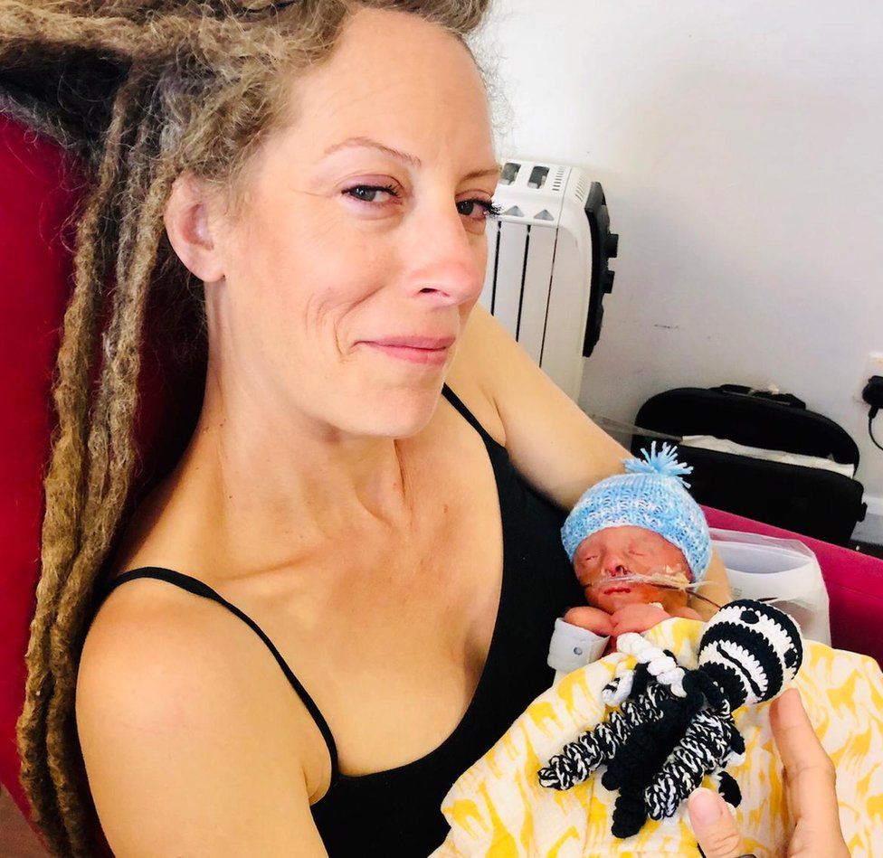 Mother Jessica Herbert holding baby Oaken in her arms