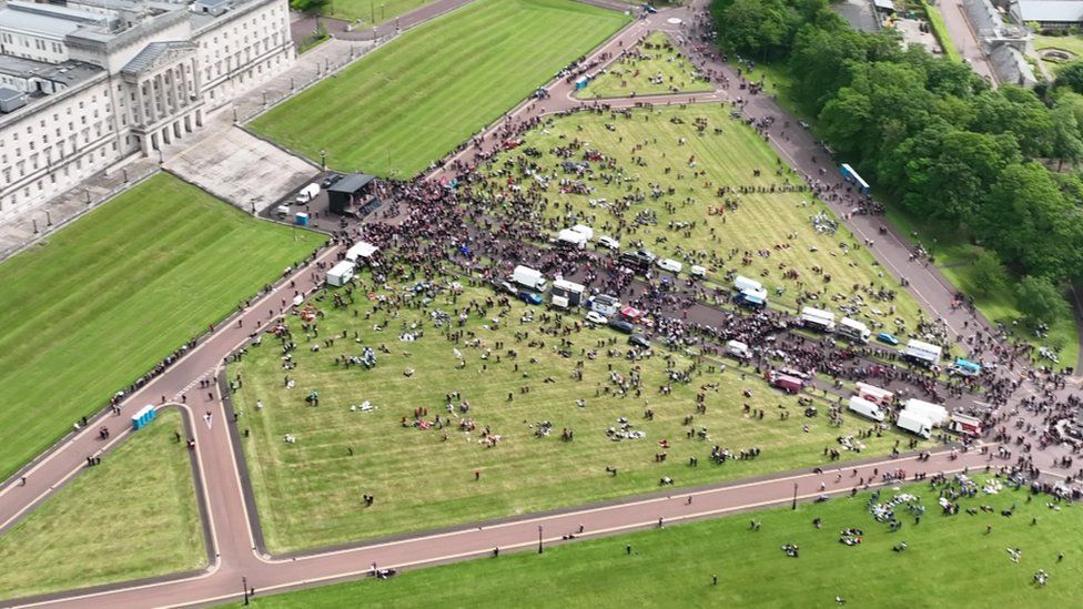 Drone footage shows the participants in the grounds of Stormont
