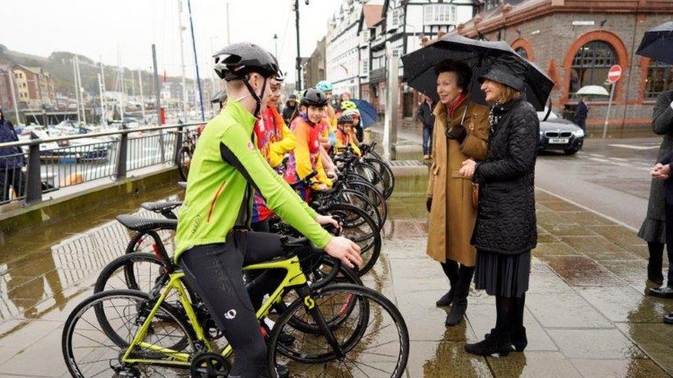 Princess Anne speaking to young cyclists