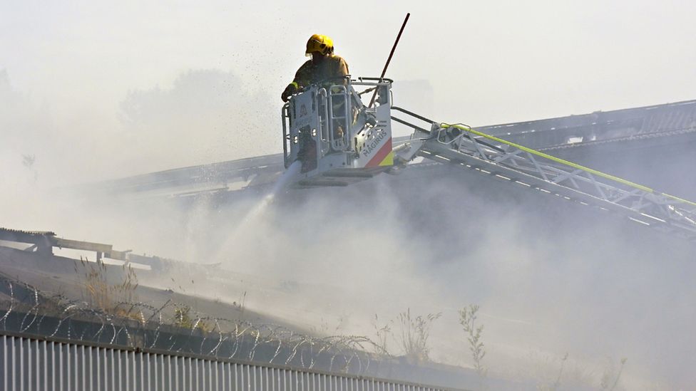 Firefighter using aerial appliance