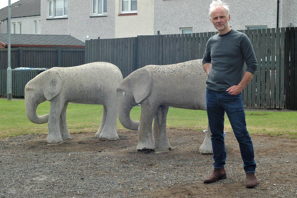 Mark Bonnar in the village of Stonehouse in Lanarkshire where he lived as a child with two of his father Stan's concrete elephants.