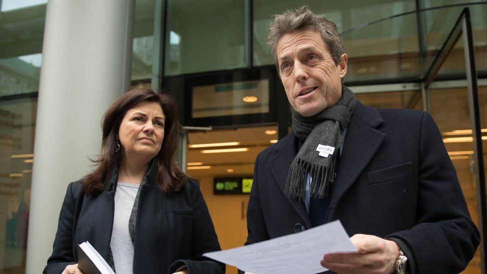 Hugh Grant and Crimewatch presenter Jacqui Hames, who also settled a phone-hacking claim, speaking after the hearing in London