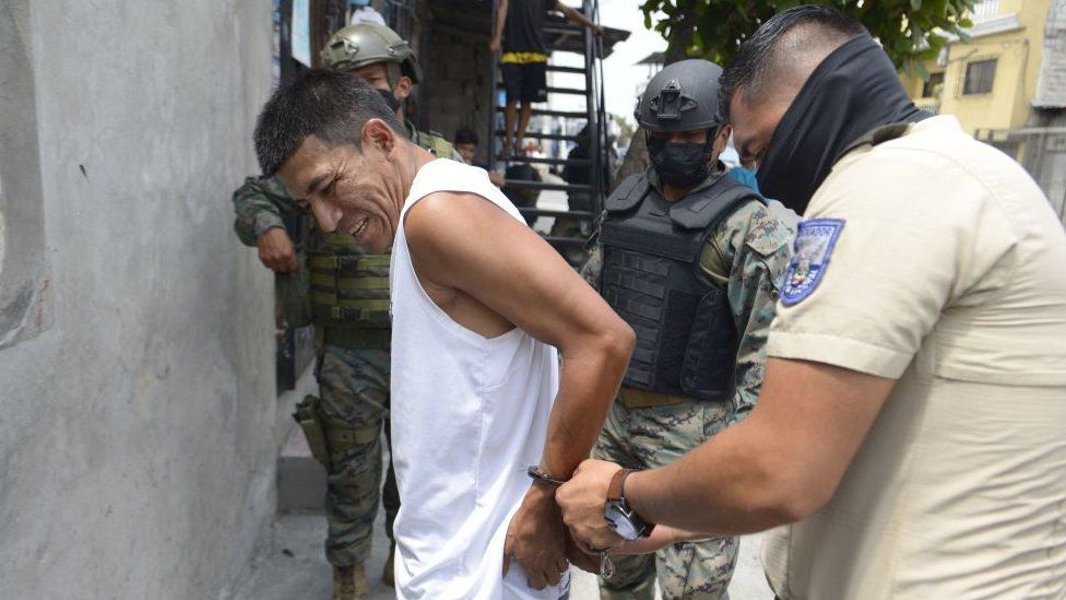 Security forces detain a suspect during security operations in southern Guayaquil, Ecuador on October 19, 2021