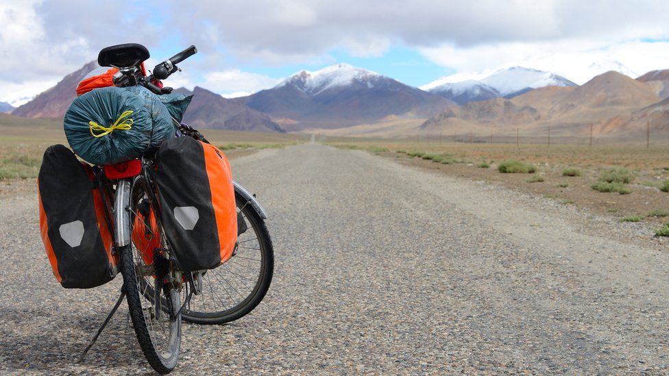 Long distance cycling on M41 Pamir Highway, Pamir Mountain Range, Tajikistan. File image
