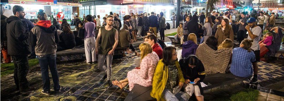 People wait in Te Aro Park after being evacuated from nearby buildings following an earthquake on 14 November 2016 in Wellington, New Zealand