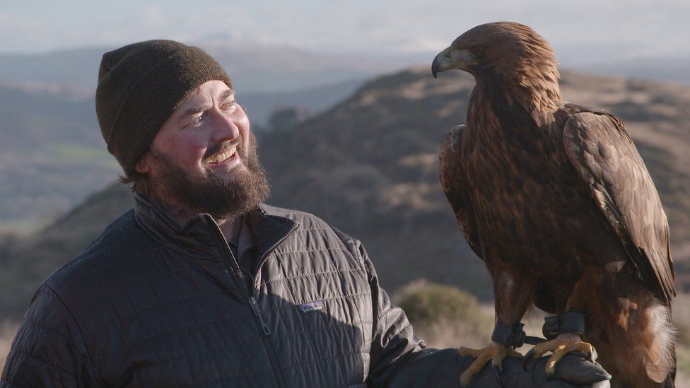 Paul O'Donoghue holding a golden eagle