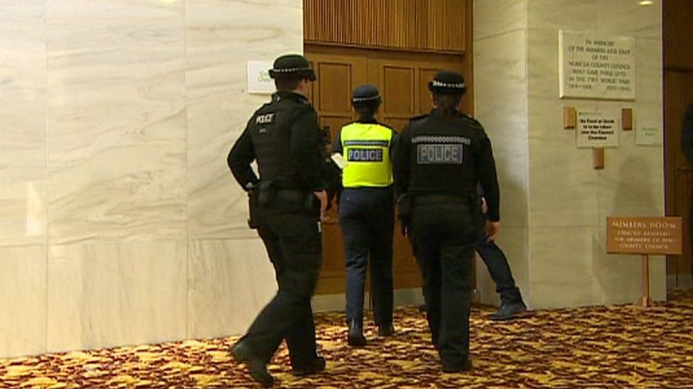 Man Charged After Norfolk County Council Meeting Protest - BBC News