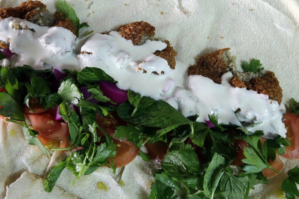 An open Falafel sandwich with all the ingredients is seen at a restaurant in Jounieh, Lebanon