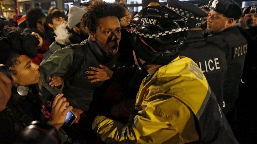A demonstrator scuffles with police in Chicago. Photo: 24 November 2015