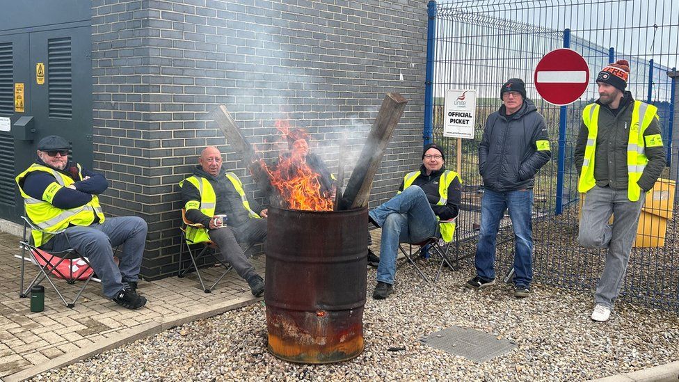 Five Go North East workers on a picket line at the firm's Consett depot on Saturday