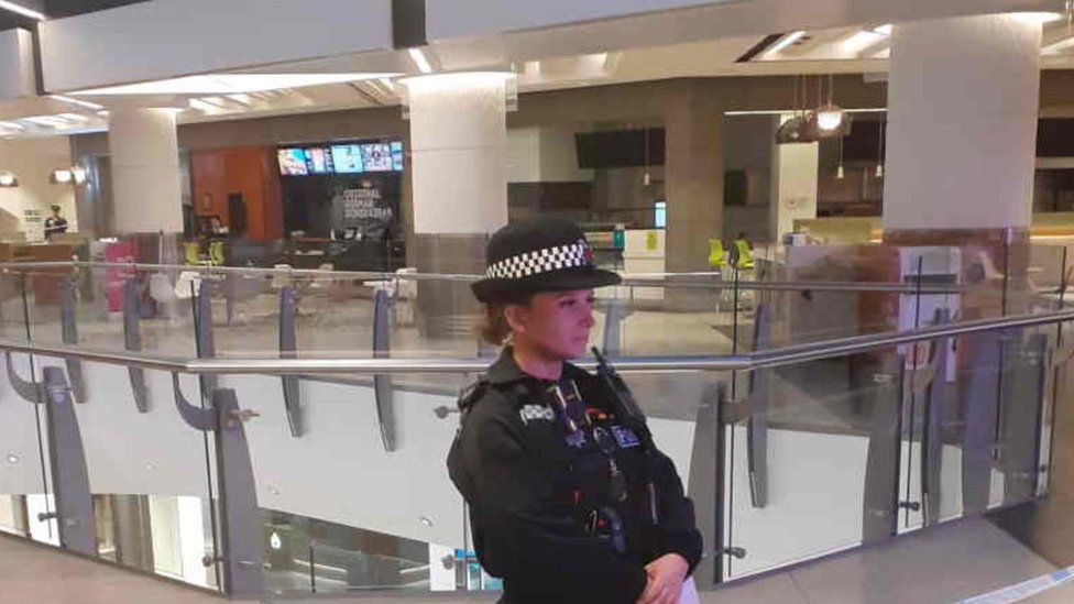 Police officer inside the Lakeside shopping centre