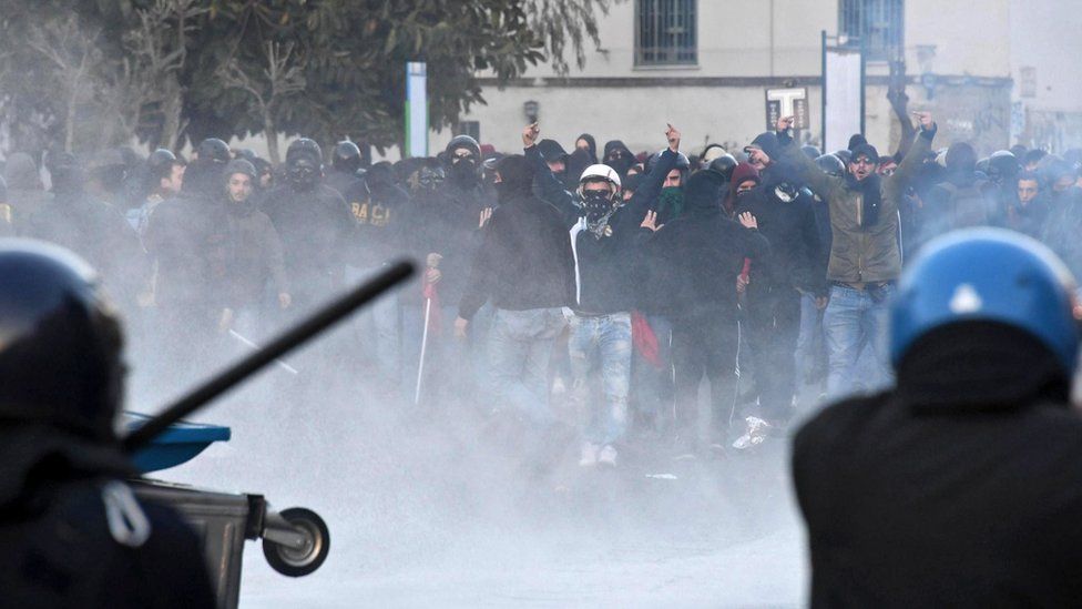 Protesters clash with riot police during a demonstration against the visit of the leader of Italian Lega Nord (North League) party, Matteo Salvini, in Naples, Italy, 11 March 2017