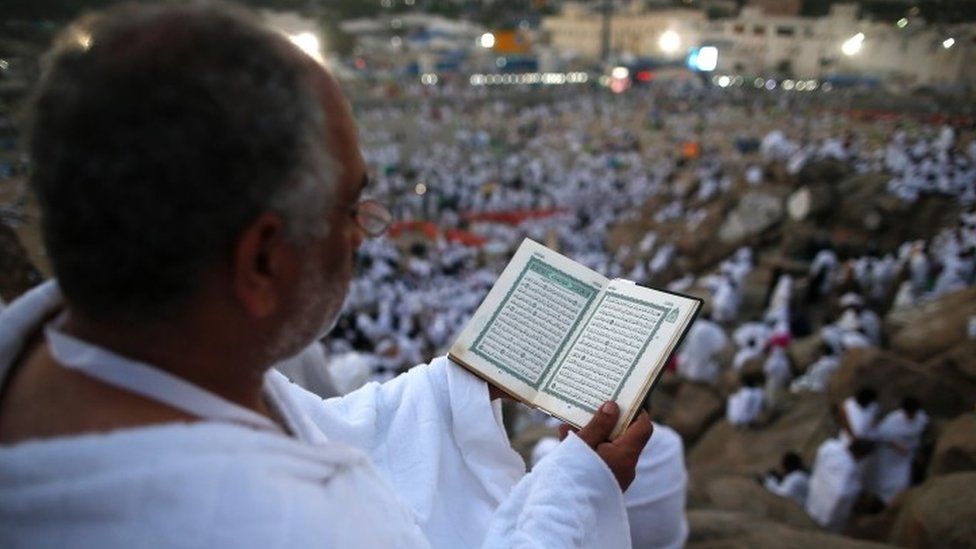 A Muslim pilgrim reads a copy of the Koran, as he joins one of the Hajj rituals on Mount Arafat (11 September 2016)
