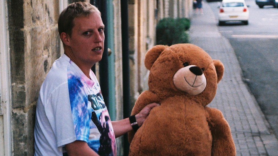 Michael Sleggs holding toy bear