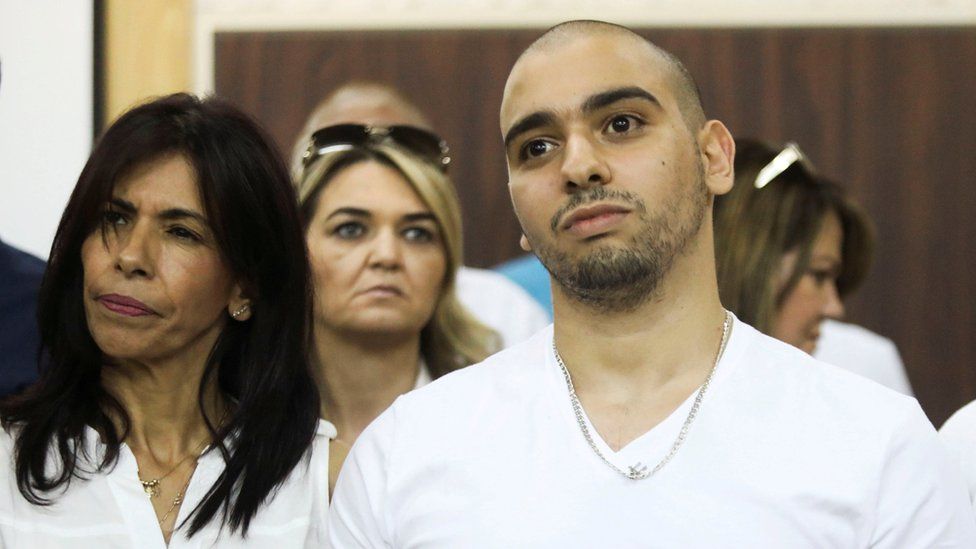 Former Israeli soldier Elor Azaria, who was convicted of manslaughter and sentenced to 18 months imprisonment for killing a wounded and incapacitated Palestinian assailant, waits to hear the ruling at an Israeli military appeals court in Tel Aviv, 27 September 2017