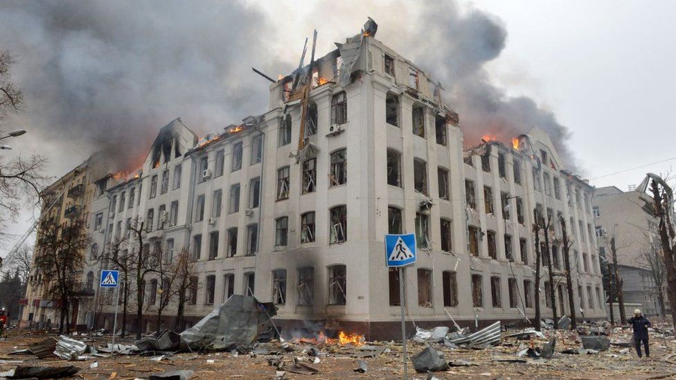 Firefighters work to contain a fire at Karazin Kharkiv National University, hit during recent shelling