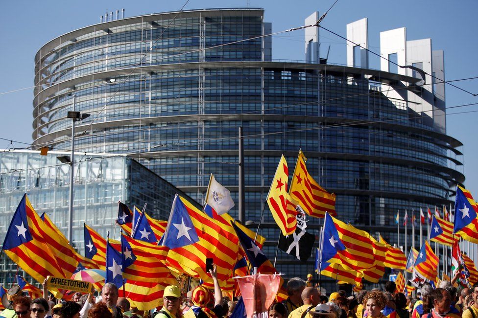 Catalan pro-independence "Estelada" flags and banners during a demonstration at the European Parliament on July 2 , 2019