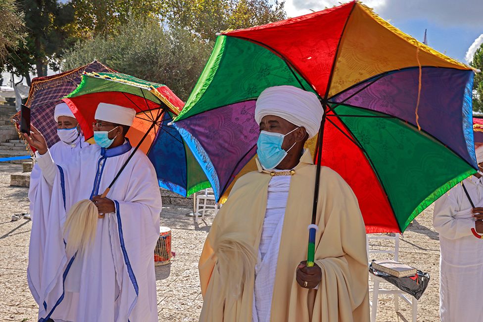 Israeli religious leaders (Kessim) of the Ethiopian Jewish community recite prayers during the Sigd holiday, marking the desire to "return to Jerusalem", as they celebrate from a hilltop in the holy city, on November 16, 2020 amid restrictions to their usual celebration to limit the spread of the Covid-19 coronavirus