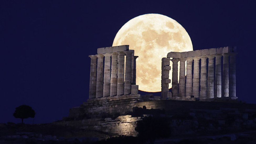 The moon rises over the Temple of Poseidon