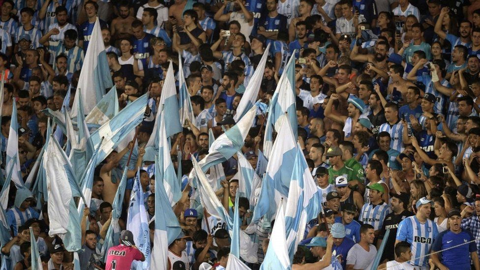 Argentina's Racing Club supporters cheer during their Copa Sudamericana football match against Colombia's Rionegro Aguilas
